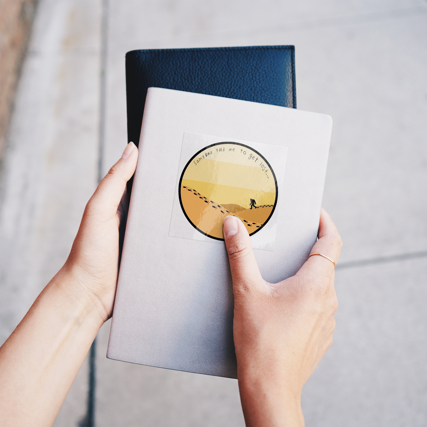 Get_Lost_Sticker_ClearSquareSticker_Notebook_Mockup.png