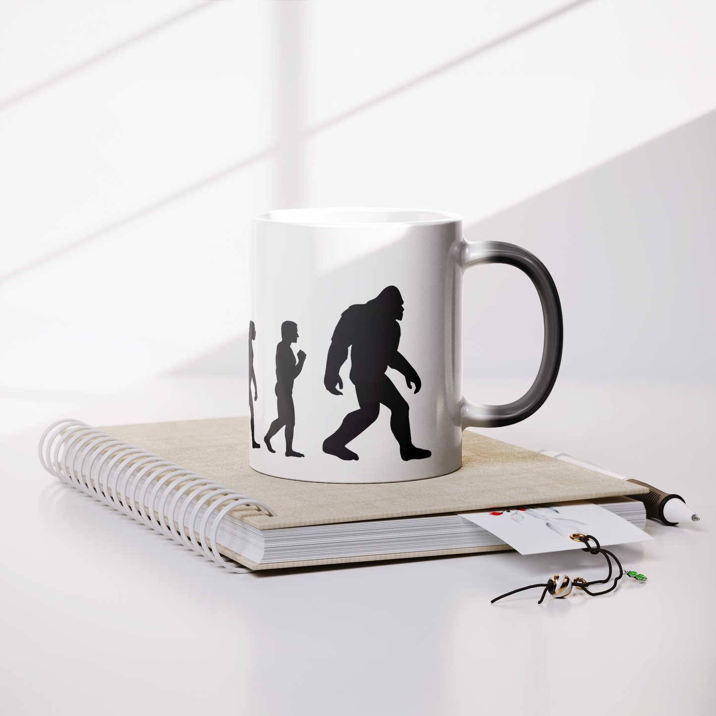 Evolution_Magic_Mug_Lifestyle_Notebook_Mockup.png